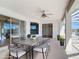 Spacious covered lanai with an outdoor dining table, offering a relaxing space for entertaining guests at 4440 Tatum St, Port Charlotte, FL 33948