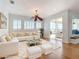 Bright living room with a cozy sectional sofa and decorative pillows at 4440 Tatum St, Port Charlotte, FL 33948