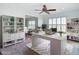 Home office with a large white desk, book shelves, and a view into another room at 4440 Tatum St, Port Charlotte, FL 33948