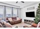 Relaxing living room with brown leather furniture and a large TV at 5226 Granite Dust Pl, Palmetto, FL 34221