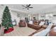 Cozy living room with leather furniture and a Christmas tree at 5226 Granite Dust Pl, Palmetto, FL 34221