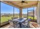 Relaxing screened porch overlooking a lake at 5226 Granite Dust Pl, Palmetto, FL 34221