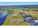 Aerial view of waterfront homes with private pools and manicured lawns at 5239 Lake Venice Dr, Wimauma, FL 33598