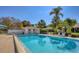 Inviting community pool with pool house and lounge chairs at 5259 Villa Majorca Ct # 26, Sarasota, FL 34235