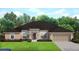 Single-story home with brown roof, attached garage, and landscaping at 5581 Centro Ave, North Port, FL 34288