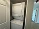 Compact laundry area with stacked washer and dryer at 6312 7Th W Ave # 6312, Bradenton, FL 34209