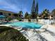 Community pool with surrounding patio and landscaping at 6312 7Th W Ave # 6312, Bradenton, FL 34209