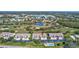 Aerial view of condo building near pool and golf course at 6713 Stone River Rd # 205, Bradenton, FL 34203