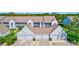 Condos with attached garages, showcasing parking and building design at 6713 Stone River Rd # 205, Bradenton, FL 34203