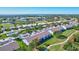 Aerial view showcasing condo building and lush landscaping at 6713 Stone River Rd # 205, Bradenton, FL 34203