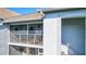 Private condo balcony with white railings and patio furniture at 6713 Stone River Rd # 205, Bradenton, FL 34203