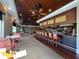 Community clubhouse bar with seating and liquor selection at 6713 Stone River Rd # 205, Bradenton, FL 34203
