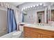 Clean bathroom with a tub, shower, and updated vanity at 6713 Stone River Rd # 205, Bradenton, FL 34203