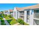 Attractive building exterior with lush landscaping at 6713 Stone River Rd # 205, Bradenton, FL 34203