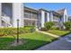 Well-maintained building exterior with landscaping at 6713 Stone River Rd # 205, Bradenton, FL 34203