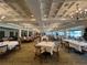 Large dining room with multiple tables and chairs at 6713 Stone River Rd # 205, Bradenton, FL 34203