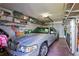 Attached garage with shelving and ample storage space for various items at 6713 Stone River Rd # 205, Bradenton, FL 34203
