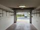 Garage with abundant shelving and an open view of the community at 6713 Stone River Rd # 205, Bradenton, FL 34203