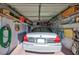 Garage with built-in shelving and a car parked inside at 6713 Stone River Rd # 205, Bradenton, FL 34203