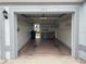 Organized garage with ample shelving for storage solutions and a well-lit interior at 6713 Stone River Rd # 205, Bradenton, FL 34203