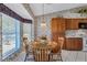 Charming kitchen nook with wood table and chairs, near window at 6713 Stone River Rd # 205, Bradenton, FL 34203