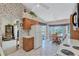 Kitchen with dining area and view into living room at 6713 Stone River Rd # 205, Bradenton, FL 34203