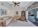 Relaxing living room with a comfortable couch and access to a balcony at 6713 Stone River Rd # 205, Bradenton, FL 34203