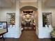Elegant community clubhouse lobby with a chandelier and seating at 6713 Stone River Rd # 205, Bradenton, FL 34203