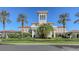 Grand clubhouse facade with manicured landscaping at 6836 Bay Hill Dr, Bradenton, FL 34202