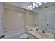 Clean bathroom with tiled walls and a shower/tub combo at 7171 Wood Creek Dr # 5, Sarasota, FL 34231