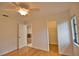 Bright bedroom with hardwood floors and a walk-in closet at 7171 Wood Creek Dr # 5, Sarasota, FL 34231