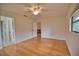 Bright bedroom with hardwood floors and access to bathroom at 7171 Wood Creek Dr # 5, Sarasota, FL 34231