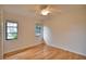 Spacious bedroom with hardwood floors and large windows at 7171 Wood Creek Dr # 5, Sarasota, FL 34231