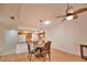 Bright dining area with hardwood floors and ceiling fan at 7171 Wood Creek Dr # 5, Sarasota, FL 34231