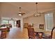 Bright dining room with hardwood floors and wood table set at 7171 Wood Creek Dr # 5, Sarasota, FL 34231