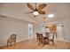 Dining room features hardwood floors and a glass-top dining table at 7171 Wood Creek Dr # 5, Sarasota, FL 34231