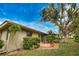 Backyard view of house with patio at 7171 Wood Creek Dr # 5, Sarasota, FL 34231