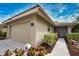 Tan one-story home with attached garage at 7171 Wood Creek Dr # 5, Sarasota, FL 34231