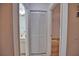 Hallway with linen closet and bathroom access at 7171 Wood Creek Dr # 5, Sarasota, FL 34231