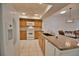 Kitchen with wood cabinets and granite countertops at 7171 Wood Creek Dr # 5, Sarasota, FL 34231