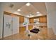Bright kitchen with granite countertops, wood cabinets, and modern appliances at 7171 Wood Creek Dr # 5, Sarasota, FL 34231