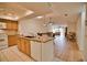 Open kitchen with island and view of living room at 7171 Wood Creek Dr # 5, Sarasota, FL 34231