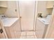 Well-lit laundry room with washer and dryer included at 7171 Wood Creek Dr # 5, Sarasota, FL 34231