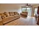 Living room with hardwood floors and comfortable seating at 7171 Wood Creek Dr # 5, Sarasota, FL 34231