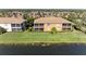 Aerial view of property, showcasing its location by the lake at 7208 River Hammock Dr # 103, Bradenton, FL 34212