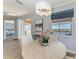 Modern dining area with lake views and stylish decor at 7208 River Hammock Dr # 103, Bradenton, FL 34212