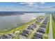 Aerial view of houses, lake, and community amenities at 7408 Cabin Ln, Sarasota, FL 34240