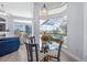 Bright breakfast nook with glass table and pool view at 7905 Royal Queensland Way, Lakewood Ranch, FL 34202