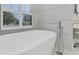 Close up of a freestanding bathtub with modern faucet at 8059 Royal Birkdale Cir, Lakewood Ranch, FL 34202