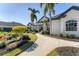 Elegant home exterior with walkway and landscaping at 8059 Royal Birkdale Cir, Lakewood Ranch, FL 34202